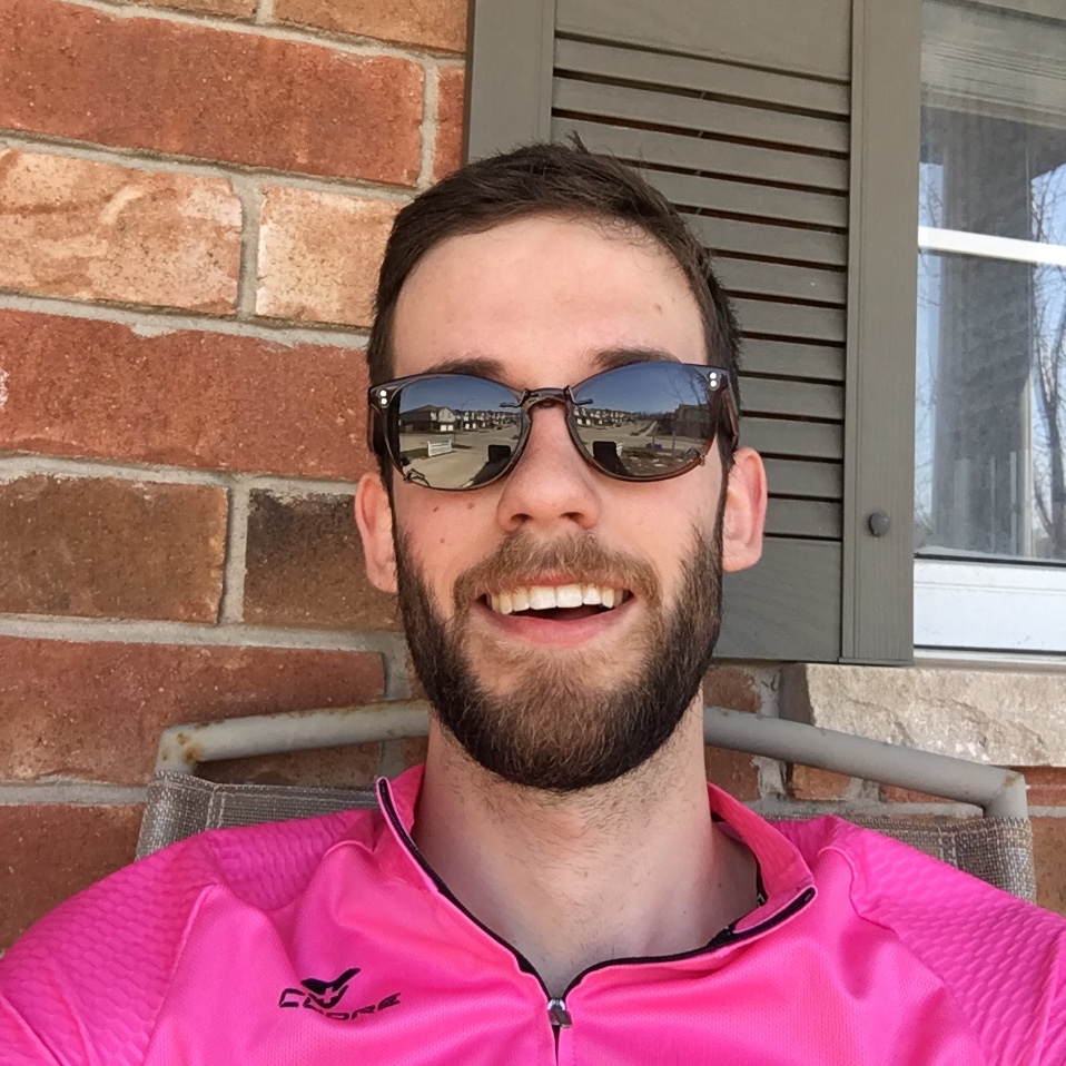 Josiah in pink shirt with sunglasses on